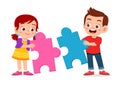 happy cute kids play solve puzzle together Royalty Free Stock Photo