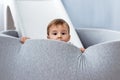 Happy cute little boy fun and enjoying playing in dry paddling pool in him room Royalty Free Stock Photo