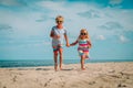 Happy cute little boy and girl running at beach Royalty Free Stock Photo