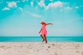 Happy cute little girl dance play on tropical beach Royalty Free Stock Photo