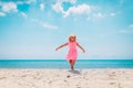 Happy cute little girl dance play on tropical beach Royalty Free Stock Photo