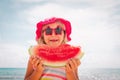 Happy cute little girl eating watermelon at beach Royalty Free Stock Photo