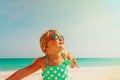 Happy cute little girl enjoy beach vacation