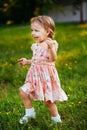 Happy cute little girl running on the grass in the park. Happiness Royalty Free Stock Photo