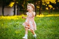 Happy cute little girl running on the grass in the park. Happiness Royalty Free Stock Photo