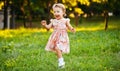 Happy cute little girl running on the grass in the park. Happiness Royalty Free Stock Photo