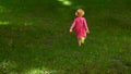 Happy cute little girl running in the park. Happiness. Royalty Free Stock Photo