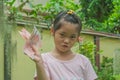 Happy cute little girl smiling and holding cash money in hand. Royalty Free Stock Photo