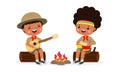 Happy cute little kids wear boy scout honor uniform playing guitar around the campfire, children girl scout cartoon flat character Royalty Free Stock Photo