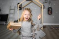 Happy cute little smiling girl with christmas gift box. Merry Christmas and Happy Holidays. Royalty Free Stock Photo