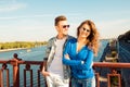 Happy cute nice couple in love embracing each other on the bridge Royalty Free Stock Photo