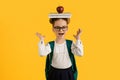 Happy Cute Schoolgirl Holding Books And Apple On Head Royalty Free Stock Photo