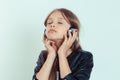 Happy cute smiling kid girl listening to music in her headphones Royalty Free Stock Photo