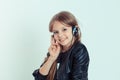 Happy cute smiling kid girl listening to music in her headphones Royalty Free Stock Photo