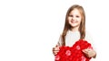 Happy cute smiling little girl, preschooler child with big red paper heart on white background Royalty Free Stock Photo