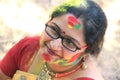 Happy cute smiling woman on holi color festival.