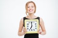 Happy cute young woman holding big clock Royalty Free Stock Photo