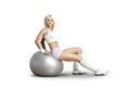 Happy cutie athletic girl sit on big ball