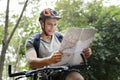 Happy cyclist riding through the forest