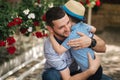 Happy dad with his little sun outdoors. Sun hug his father Royalty Free Stock Photo