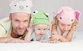 Happy dad with kids in funny hats Royalty Free Stock Photo