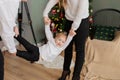 Happy dad and mom swing their daughter in their arms. Royalty Free Stock Photo