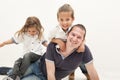 Happy dad plays with little multi-ethnic children Royalty Free Stock Photo