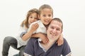 Happy dad plays with little multi-ethnic children Royalty Free Stock Photo