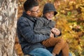 Dad and son playing together outdoors in the park Royalty Free Stock Photo