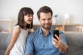 Happy dad taking selfie with kid on smartphone at home Royalty Free Stock Photo