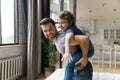 Happy daddy giving piggyback ride to adorable son. Royalty Free Stock Photo