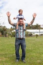Happy daddy and son having fun outdoors