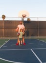 happy daddy and son play basketball with ball on playground, happy family