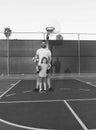 happy daddy and son play basketball with ball on playground, happy family