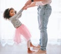 Happy, dance and girl with father dancing in a living room, love, family and fun in their home together. Portrait