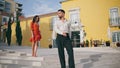 Dancers latin american style performing on town stairs. Passionate couple moving Royalty Free Stock Photo