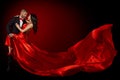 Happy Dancing Couple Portrait, Woman in Red Silk Gown and Handsome Beard Man in Suit, Flying Waving Fabric Royalty Free Stock Photo