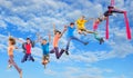 Happy dancing jumping children in sky Royalty Free Stock Photo