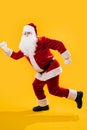 Happy dancing Santa Claus doing a version of a walking man move Royalty Free Stock Photo