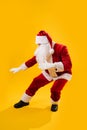 Happy dancing Santa Claus making peculiar moves Royalty Free Stock Photo