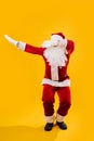 Happy dancing Santa Claus squating and waving hands Royalty Free Stock Photo