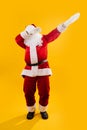 Happy dancing Santa Claus squating and waving hands Royalty Free Stock Photo