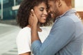 Happy date. Tender couple touching foreheads outdoors