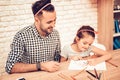 Happy Daughter with Father Draw Picture on Table. Royalty Free Stock Photo