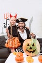 happy daughter and father in halloween costumes Royalty Free Stock Photo