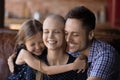 Happy daughter kid and dad hugging ill hairless mom Royalty Free Stock Photo