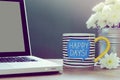 HAPPY DAY! coffee on office desk with white aster flower in vase Royalty Free Stock Photo