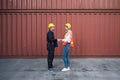 Happy dealing shaking hands two foreman man & woman worker working checking at Container cargo harbor to loading containers. Dock Royalty Free Stock Photo