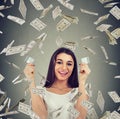 Happy debt free woman holding a credit card cut in two pieces Royalty Free Stock Photo