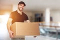 Happy delivery man with box Royalty Free Stock Photo
